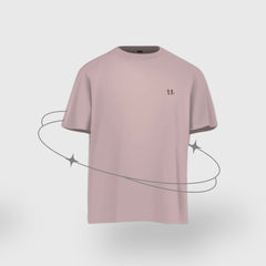 Pink t-shirt with a small logo on a light gray background